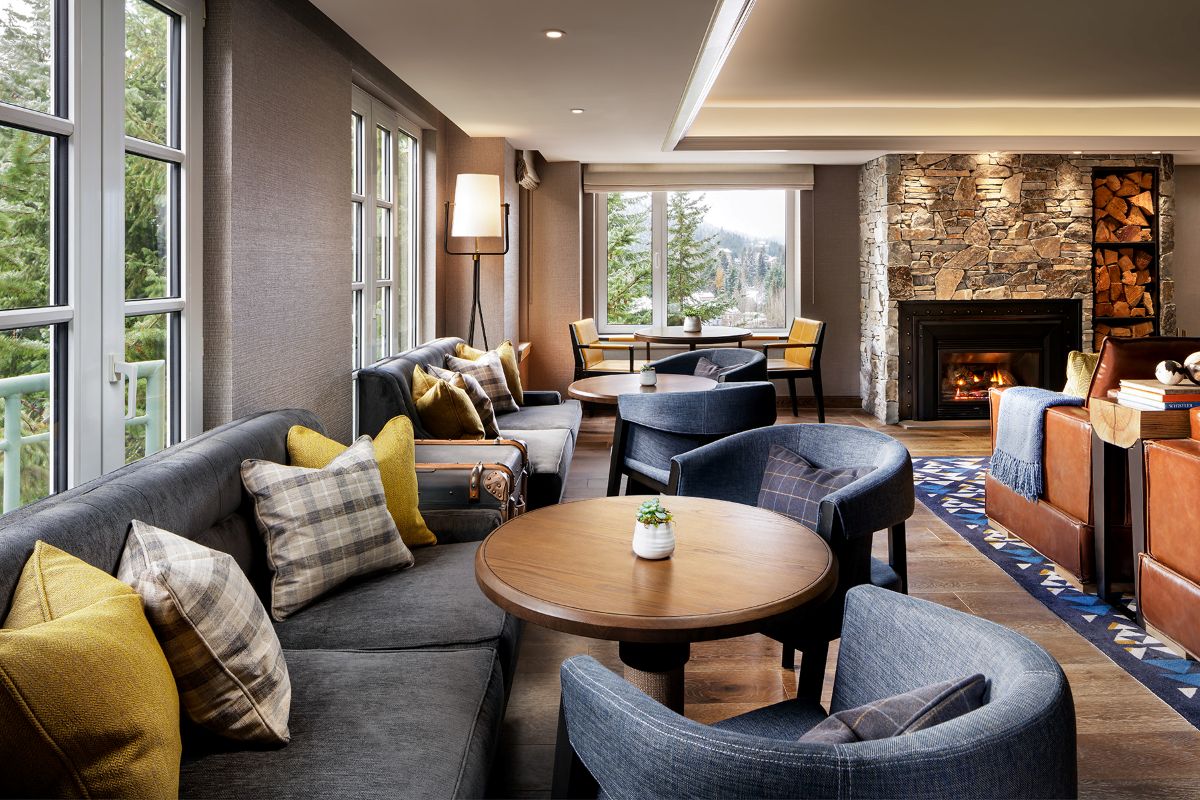 Fairmont Chateau Whistler Gold Floor - gold lounge with fireplace and comfy seating